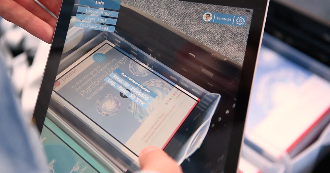 Auf diesem Bild wird Augmented Reality auf dem Tablet angewandt, um eine Handling Unit zu identifizieren: Mit Klick die zugewiesenen Schaltflächen lassen sich weitere Informationen einblenden.